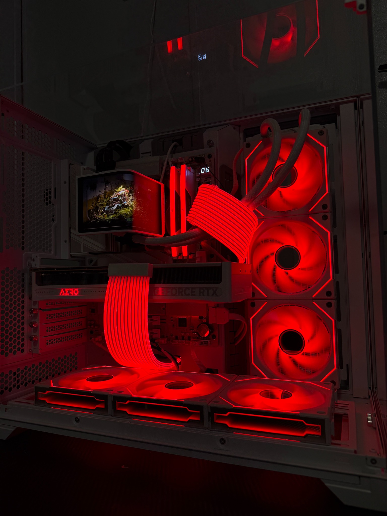 Custom PC build with white components and red lighting